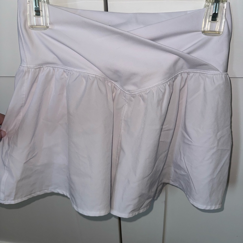 White athletic cross-over shorts